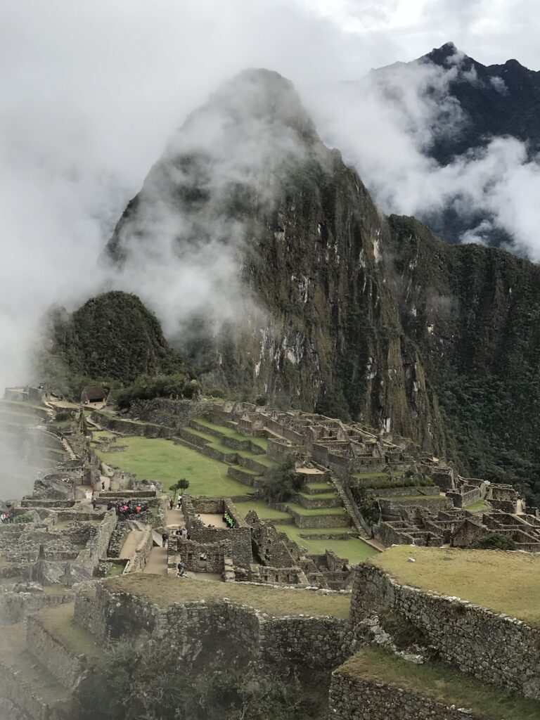 Misty clouds over the ancient Machu Picchu ruins in Peru.